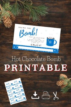 the hot chocolate bomb printable is next to pine cones