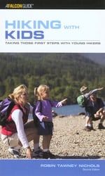 the cover of hiking with kids shows two children pointing at something in front of them