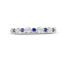 a white gold ring with blue sapphires and diamonds