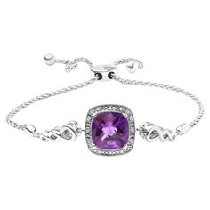 Indulge in the luxury of this exquisite lariat bracelet that captures the essence of elegance and sophistication. The centerpiece of this stunning bracelet is a gorgeous 10mm cushion-cut amethyst gemstone that adds a pop of regal purple color to your outfit. Sparkling round-cut diamonds, totaling 0.05 cttw, delicately encircle the amethyst gemstone, adding a touch of glitz and glamour. The adjustable bolo chain features a unique lariat design that allows you to adjust the length of the bracelet, ensuring a perfect fit for your wrist. This versatile bracelet is crafted from .925 sterling silver and finished with a sleek bolo clasp, making it an excellent addition to any jewelry collection. Treat yourself or a loved one to this charming amethyst and diamond accent lariat bolo bracelet, perfe Bolo Bracelet, Bracelet Collection, Amethyst Gemstone, Purple Amethyst, Cushion Cut, Link Bracelets, Sterling Silver Bracelets, Diamond White, Purple Color