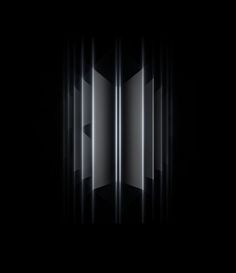 an abstract black and white background with vertical lines in the center, as if it were made out of metal