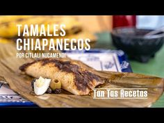 some food is laying out on a cutting board with the words tamales chiapancos