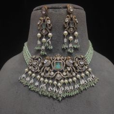 Show off your refined style with this stunning adornment! A stunning ensemble featuring mint beads, and CZ stones, along with dangling moti embellishments, creating a perfect example of exquisite craftsmanship that will add a touch of elegance to any style. The set includes a necklace and a pair of matching earrings. Approximate earrings length is 2.6". Gold-plated on high-quality brass as base metal. Made by order. Kindly allow 5-7 weeks for the delivery of this item. For custom or urgent reque