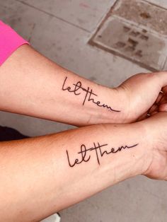 two people with matching tattoos on their arms that say, let them be there and the rest is written in cursive font