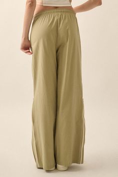 Solid cotton pants Functional side zippers. Drawstring elastic waist. Metallic drawstring hardware. Side seam pockets. Wide leg. Loose fit. 100% Cotton. Imported. Designed in LA. Model wears size S. Vintage Canvas, Iron Decor, Drawstring Pants, Cotton Pants, Side Zipper, Side Zip, Elastic Waist, Wide Leg, Loose Fitting