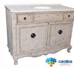 an old white cabinet with two drawers and a sink