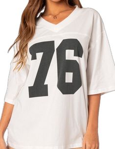 Oversized V-neck T-shirt With Letter Print, Sporty White T-shirt With Number Print, White Number Print Top For Streetwear, White Cotton T-shirt With Number Print, Sporty White Tops With Number Print, Sporty White Top With Number Print, Sporty Oversized V-neck T-shirt, Oversized Sporty V-neck T-shirt, Oversized V-neck Sporty T-shirt