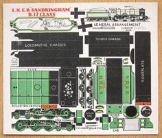 a paper model of a train station with instructions on how to build it and where to put the track