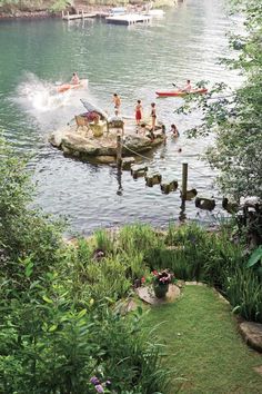 children playing in the water at a lake