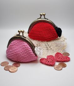 two crocheted purses sitting next to each other on top of a doily