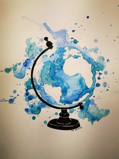 a drawing of a globe with blue paint splattered on it