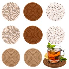 four coasters with different patterns and tea cup on the top one is filled with green leaves