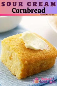 a close up of a piece of cornbread on a towel with cream in the middle