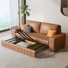 a living room with a brown leather couch and coffee table on top of the floor