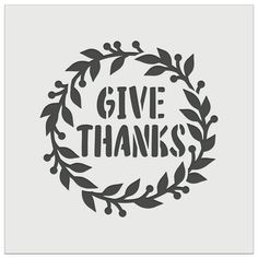 the words give thanks in a circle surrounded by leaves and branches on a gray background