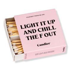 a pink box filled with matchsticks that says light it up and chill the out