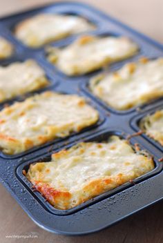 some food is in a muffin tin on a table