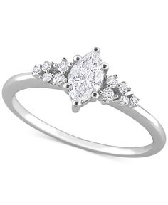 a white gold ring with three pear shaped diamonds