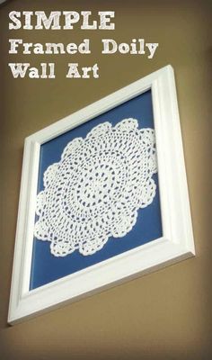 a framed doily is hanging on the wall with text overlay that reads simple framed doily wall art