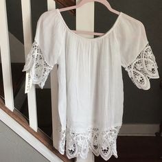 Bought This Top In Italy And Have Never Worn, Shows No Size On The Tag But Fits Like A S. It’s Like A Cotton Gauze Material With Beautiful Lace On The Sleeves And Hem. Pretty Sheer So Would Probably Need To Wear Something Underneath. Ptp 17 1/2”, Length Including Lace Is 21” Beach Cotton Tops With Lace Trim, White Cotton Blouse For Beach Season, Casual Beach Top With Lace Trim, Casual Tops With Lace Trim For The Beach, Short Sleeve Tops With Lace Trim For Beach, Beach Tops With Lace Trim And Short Sleeve, Tunic Tops, Color White, In Italy