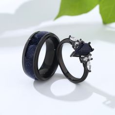 two black rings with blue and white diamonds