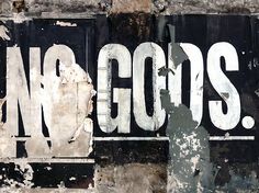 an old black and white sign that says no gogs on the side of a building