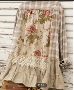 an old fashioned blouse with flowers on it and lace trimming around the hems