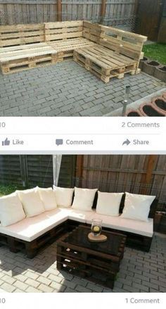 an outdoor couch made out of wooden pallets and some white pillows on top of it