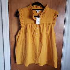 Size Large. 22 A To A. 25l In Back From Lower Collar To Hem. Dark Mustard Yellow Color. From The Reimagined Collection. 100% Cotton, Super Soft! Crinkled. Small Ruffle Around Arm & Neckline. 3/4 Button Down. Yellow Relaxed Fit Cotton Blouse, Yellow Relaxed Fit Tops, Mustard Relaxed Fit Top For Spring, Yellow Cotton Blouse With Relaxed Fit, Mustard Relaxed Fit Tops For Summer, Mustard Sleeveless Cotton Top, Casual Mustard Cotton Blouse, Yellow Relaxed Fit Top For Work, Sleeveless Mustard Cotton Tops