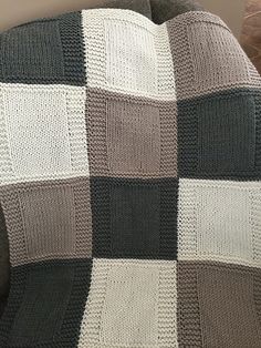 a blanket that is sitting on top of a couch