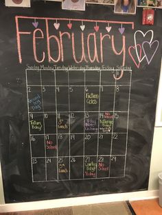 a chalkboard calendar with hearts on it