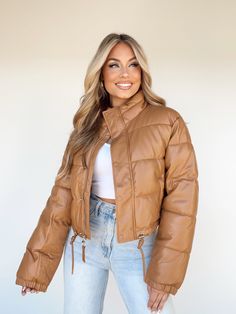 Stay warm and fashionable this season with our Leather Puffer Coat. Crafted from high-quality faux leather, this stylish and trendy coat is designed to protect you from the elements, providing the perfect balance of fashion and function for the winter, fall, and snowy months. Complete with quilted details and zipper closures, this luxurious piece will keep you looking good and feeling great all season long. Winter Leather Puffer Jacket For Cold Weather, Winter Leather Outerwear, Solid Leather Winter Outerwear, Leather Outerwear For Cold Weather, Faux Leather Outerwear For Cold Winter Weather, Faux Leather Outerwear With Faux Fur Lining, Faux Leather Outerwear For Winter, Leather Outerwear For Outdoor, Winter Faux Leather Puffer Outerwear