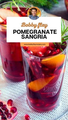 two glasses filled with pomegranate sangria on top of a table