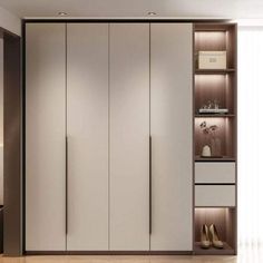 a bedroom with white and brown closets, shoes on the floor and a lamp