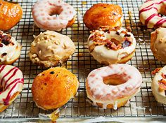 a bunch of doughnuts that are on a cooling rack