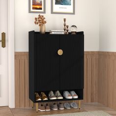 there is a black cabinet with shoes on it