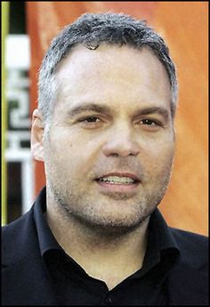 a man with grey hair and black shirt