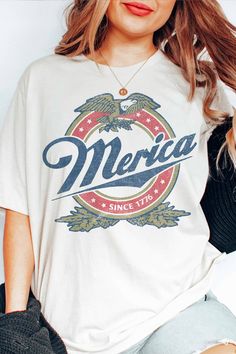 The Plus 'Merica Graphic Tee | JQ Clothing Co. American Retro Cotton Relaxed Fit Top, Relaxed Fit Graphic Print Americana Tops, American Retro Relaxed Fit Cotton Top, American Retro Cotton Tops With Relaxed Fit, Relaxed Fit Americana Tops With Graphic Print, American Retro Cotton Top With Relaxed Fit, Graphic Tee Shirt Made In Usa With Relaxed Fit, Relaxed Fit Graphic Tee Shirt Made In Usa, Relaxed Fit Graphic Tee Made In Usa