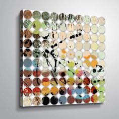 an abstract painting with circles and numbers on the wall in front of a gray background