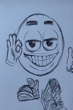 a drawing of a smiley face with two thumbs up