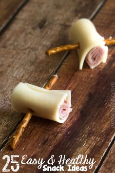 some food that is on top of a wooden table with the words 25 easy and healthy snack ideas