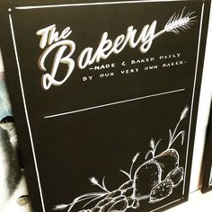 the bakery sign is black with white lettering