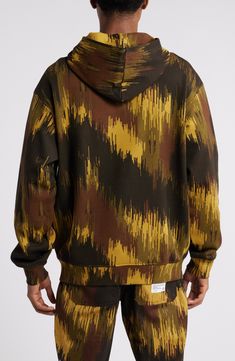 Vertical streaks update the earthy camo print covering a hoodie made of cotton French terry that's soft and loopy on the interior for relaxed, easy-wearing comfort. Fixed hood Ribbed cuffs and hem Kangaroo pocket 100% cotton Hand wash, line dry Imported Black Owned/Founded Fashion Attire, Camo Print, Kangaroo Pocket, French Terry, Kangaroo, Pullover Hoodie, Camo, Ice Cream, Hand Wash