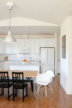 the kitchen is clean and ready to be used as a dining room or living room