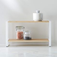 a shelf that has some jars on it