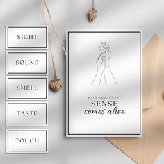 a white greeting card with the words, sight sound smell taste touch and some tassels