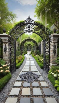 an entrance to a garden with stone walkways and iron gates leading into the yard