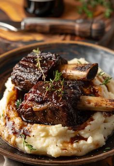 a plate topped with mashed potatoes and meat