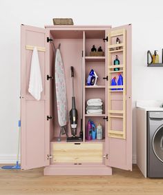 an open pink cabinet next to a washer and dryer