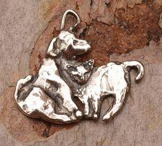 Sterling silver cat and dog charm has a flat backside that is etched Buddies. Adorable pals! Cute in earrings or a charm. Made in New Mexico from sterling silver using the time-honored art of lost wax casting. Created by one of our favorite artists from the Mountains of her home and studio. -Size Cat Beads, Cat Bead, Dog Charm, Sterling Silver Cat, Silver Cat, Dog Charms, Wax Casting, Lost Wax Casting, Cat And Dog